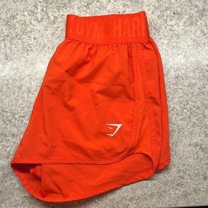 GYMSHARK TRAINING LOOSE FIT SHORTS ORANGE